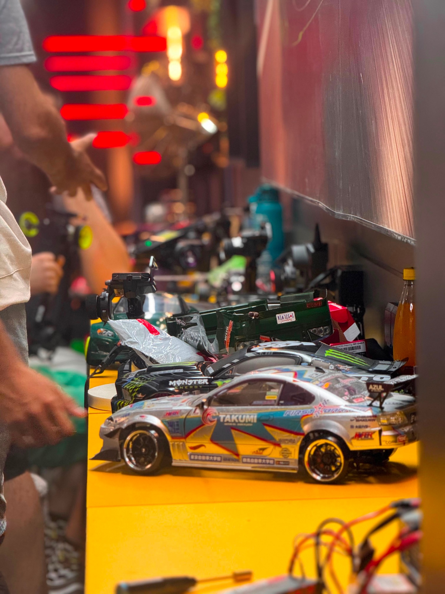 Row of RC drift cars on the pit bench